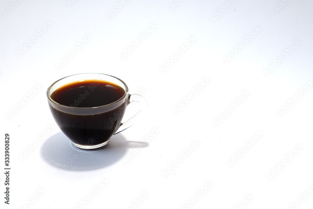 Black coffee in glass on white background. Black coffee in glass on white background.