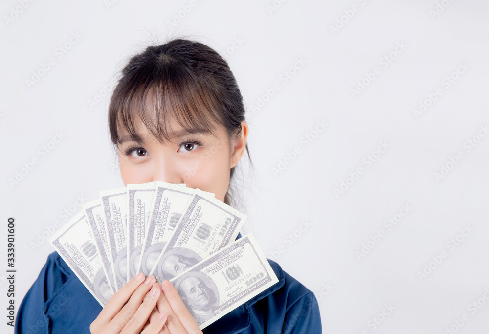 Beautiful portrait young business asian woman holding money isolated on white background, businesswoman showing banknotes with excited, happy girl income with profit finance and success concept. Beautiful portrait young business asian woman holding money isolated on white background, businesswoman showing banknotes with excited, happy girl income with profit finance and success concept.