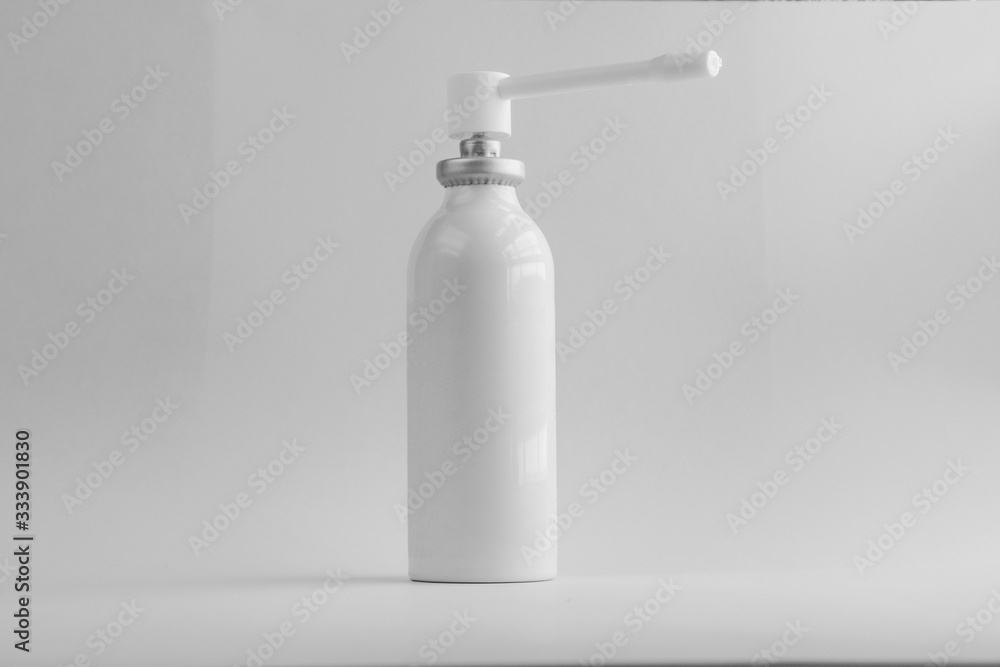 Spray against a sore throat on a black-white background. Spray against a sore throat on a black-white background.