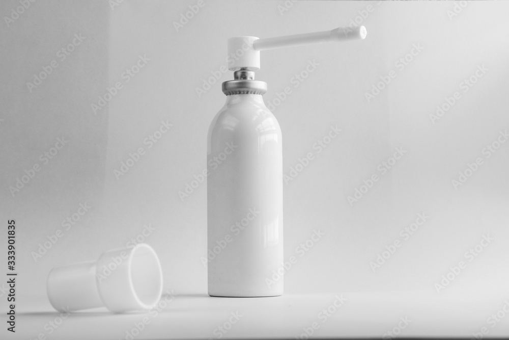 Spray against a sore throat on a black-white background. Spray against a sore throat on a black-white background.