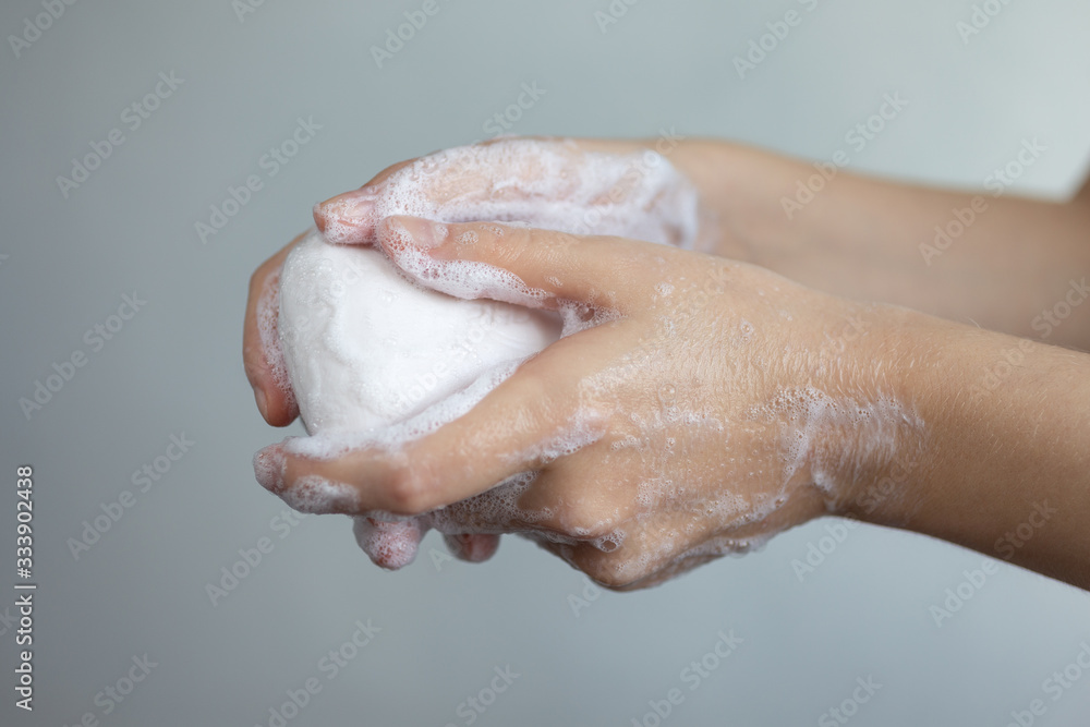 Washing hands with foamy white soap, protection against coronavirus. Close up Washing hands with foamy white soap, protection against coronavirus. Close up