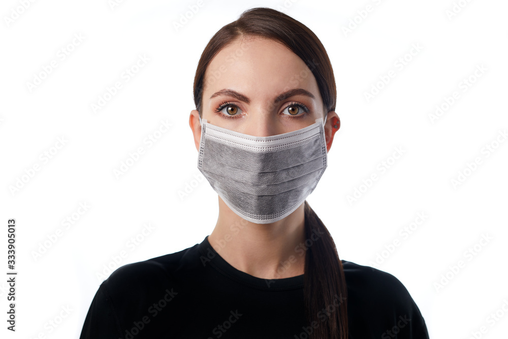 Young doctor wearing medical mask on face, coronavirus covid 19 pandemic prevention protection lifestyle concept. Human health equipment hospital sick patient hygiene uniform. White background. Young doctor wearing medical mask on face, coronavirus covid 19 pandemic prevention protection lifestyle concept. Human health equipment hospital sick patient hygiene uniform. White background.
