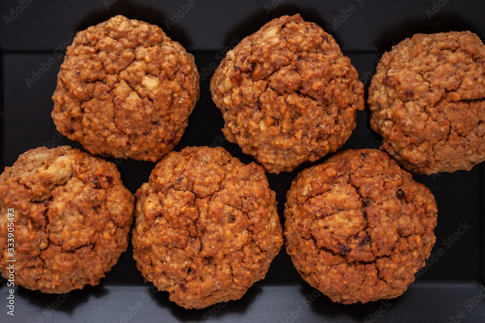 homemade baked oat cookies on black plate homemade baked oat cookies on black plate
