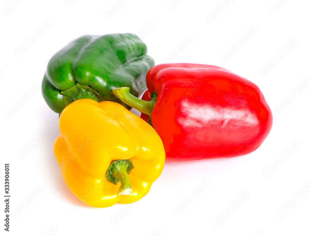 green , yellow and red bell peppers on white background green , yellow and red bell peppers on white background