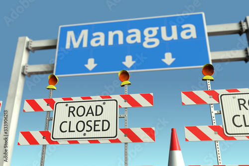 Traffic barricades at Managua city traffic sign. Coronavirus disease quarantine or lockdown in Nicaragua conceptual 3D rendering © Alexey Novikov