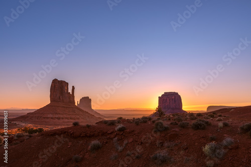 Beautiful sunrise view of famous Buttes of Monument Valley on the border between Arizona and Utah, USA