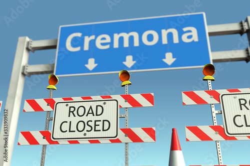 Road barricades near Cremona city road sign. Lockdown in Italy conceptual 3D rendering © Alexey Novikov