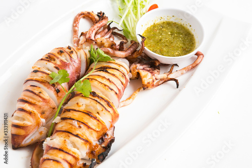 grilled squids eat with thai spicy seafood sauce