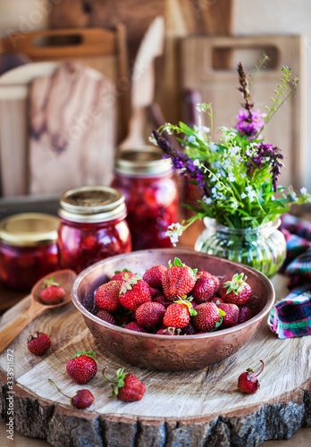 Fresh ripe summer organic strawberry on rustic wooden background