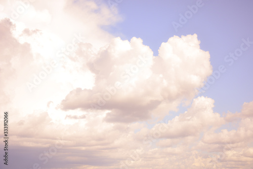 Beautiful cumulus clouds on a background of blue sky © Natalia