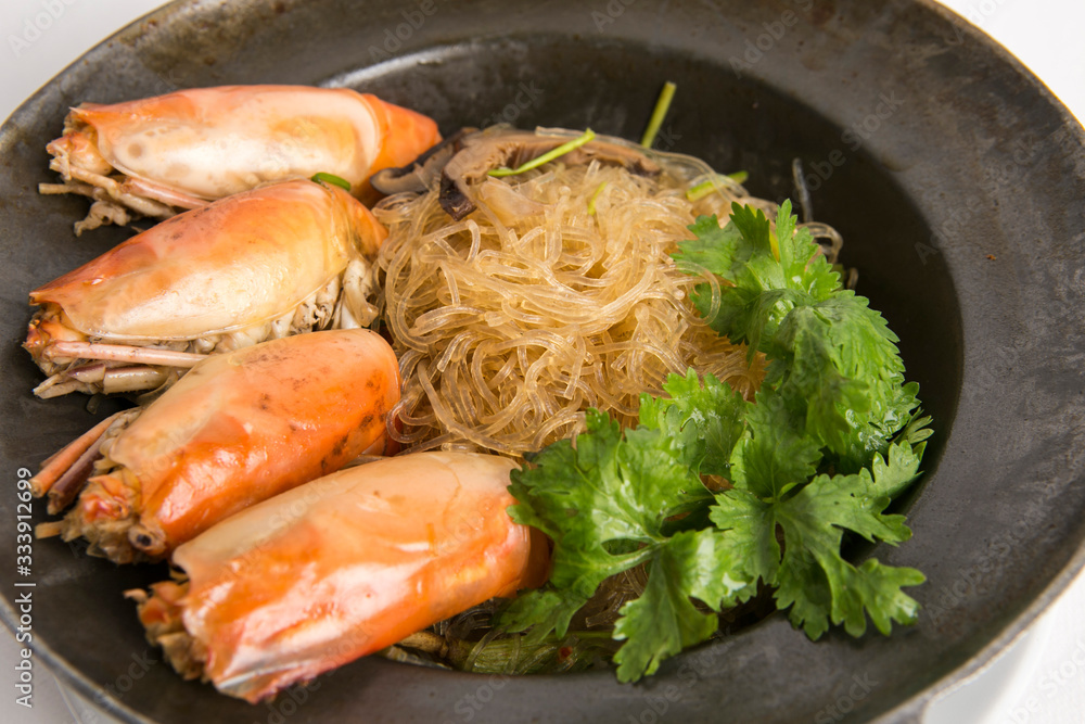 casseroled prawns with glass noodles top with shitake mushrooms and coriander serve in black pot casseroled prawns with glass noodles top with shitake mushrooms and coriander serve in black pot