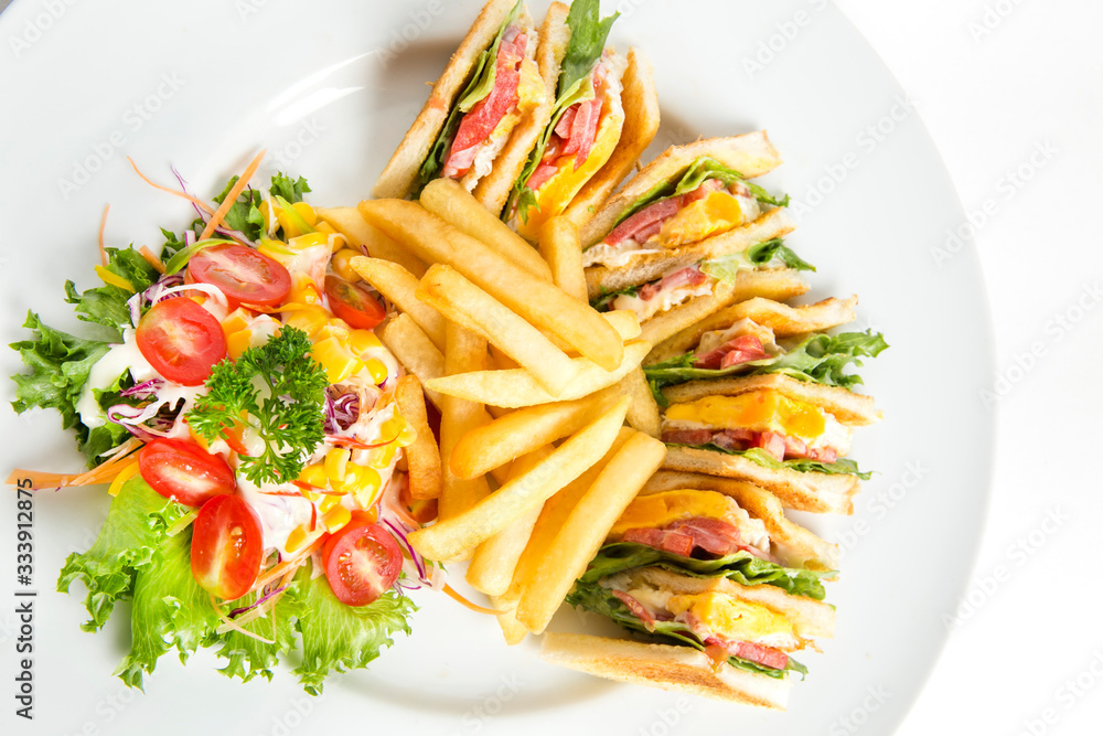 toast bread sandwich grilled with fried egg tomatoes lettuce serve with french fried and salad toast bread sandwich grilled with fried egg tomatoes lettuce serve with french fried and salad