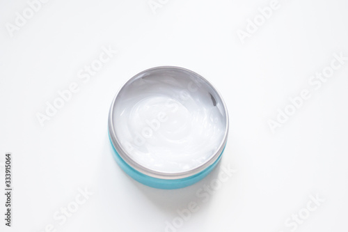 Jar with white cream for hands, face, body, top view