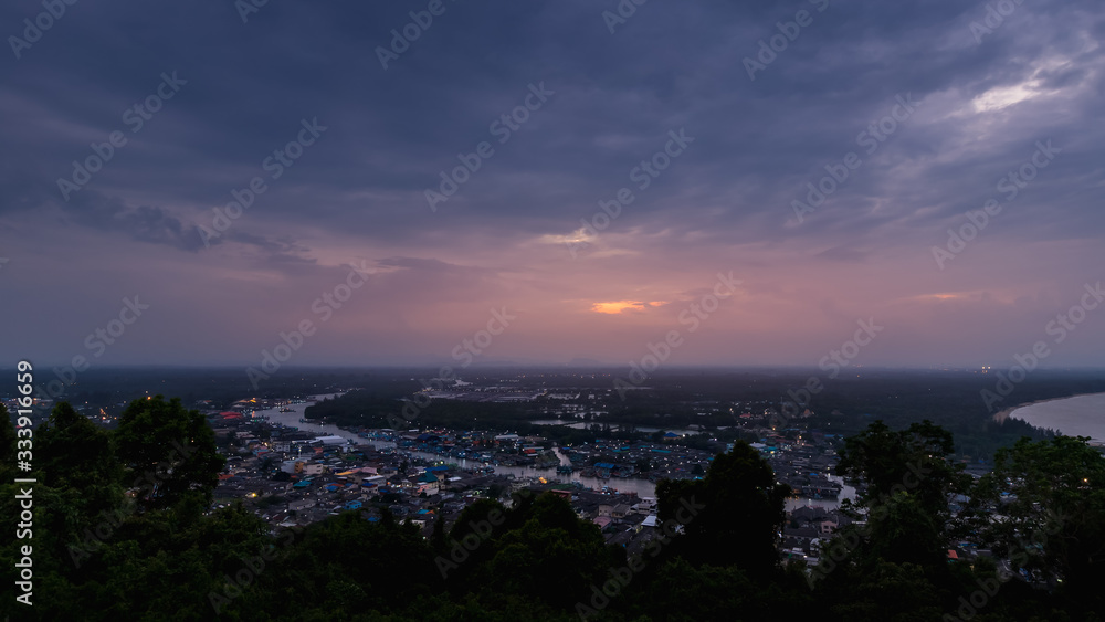 Pak Nam Chumphon town, fisherman village, and river from Khao Matsee scenic viewpoint during twilight