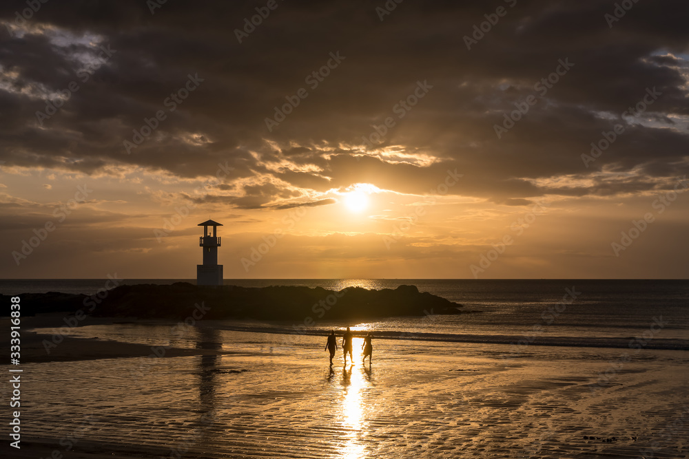 Famous Khao Lak beach with light beacon or lighthouse for navigation, during sunset, Phang-Nga, Thailand