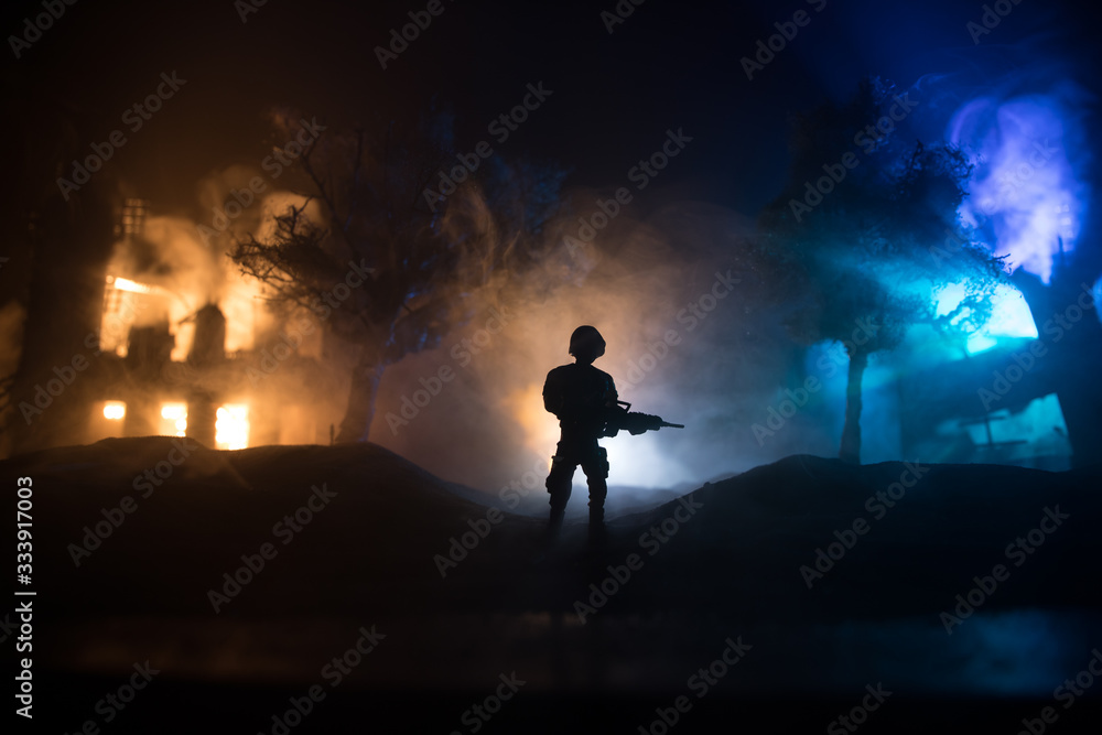 Fototapeta premium War Concept. Military silhouettes fighting scene on war fog sky background, World War Soldiers Silhouette Below Cloudy Skyline At night.