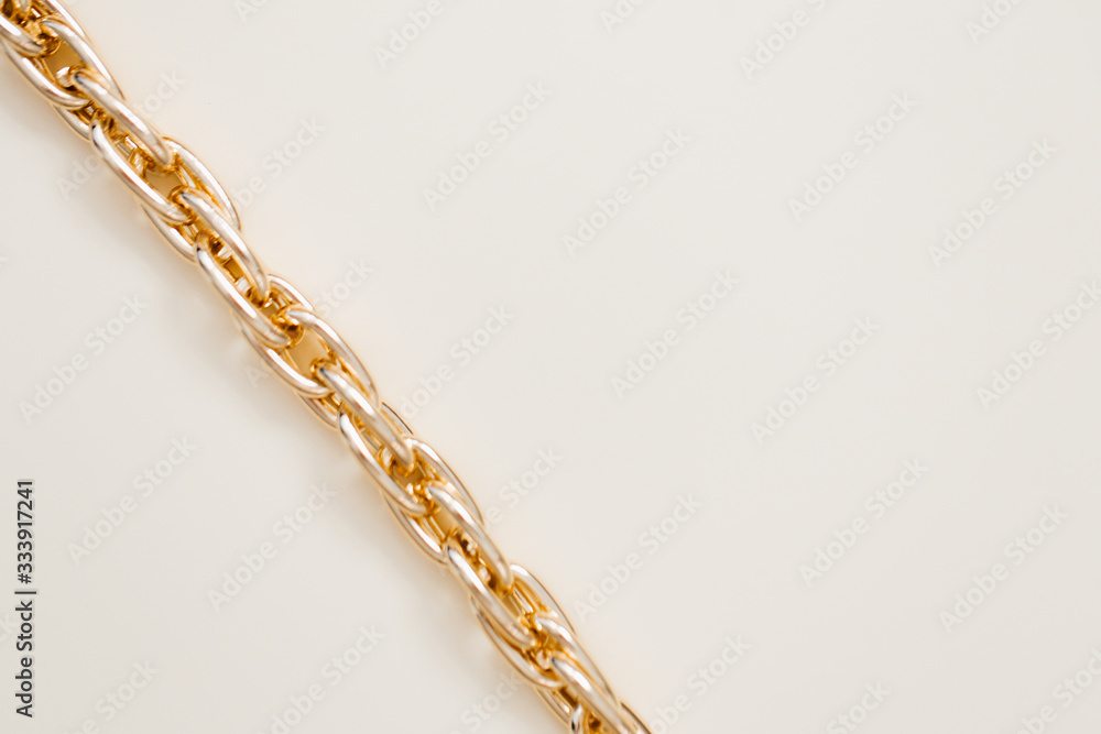 massive golden braided chain bracelet on a white background in isolation copy space place text massive golden braided chain bracelet on a white background in isolation copy space place text