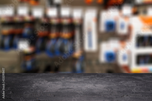 Black stone surface on bokeh background in hardware store. photo