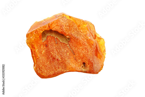 Amber on a white background. Cut out image. Macro shot of a sun stone. Petrified resin of tropical trees. Fossil resin. Material for jewelers. Digging. Baltic mineral. Crystal. Geological findings