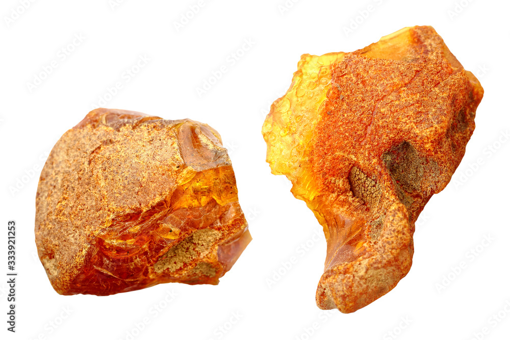 Amber on a white background. Cut out image. Macro shot of a sun stone. Petrified resin of tropical trees. Fossil resin. Material for jewelers. Digging. Baltic mineral. Crystal. Geological findings Amber on a white background. Cut out image. Macro shot of a sun stone. Petrified resin of tropical trees. Fossil resin. Material for jewelers. Digging. Baltic mineral. Crystal. Geological findings