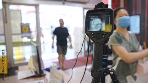 Wallpaper Mural Temperature check at a supermarket, grocery store with thermal imaging camera installed. Image monitoring scanner to monitor the body temp of visitor customer. Coronavirus pandemic outbreak. Covid-19. Torontodigital.ca
