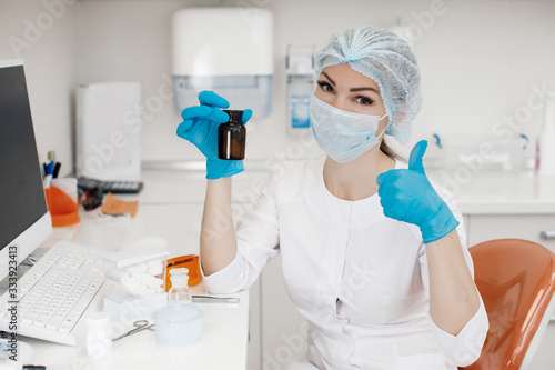 Medical doctor working in research lab. Science assistant making experiments. Laboratory tools  microscope  test tubes  equipment. Chemistry  medicine  biochemistry and healthcare.Covid-19 concept.