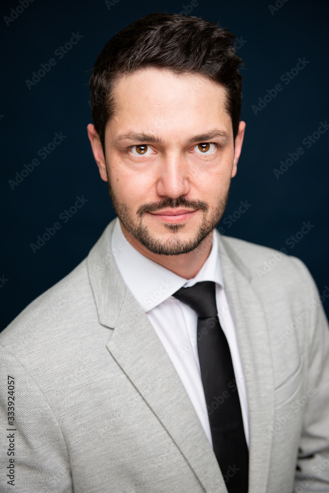Portrait of business young handsome male posing to camera Portrait of business young handsome male posing to camera