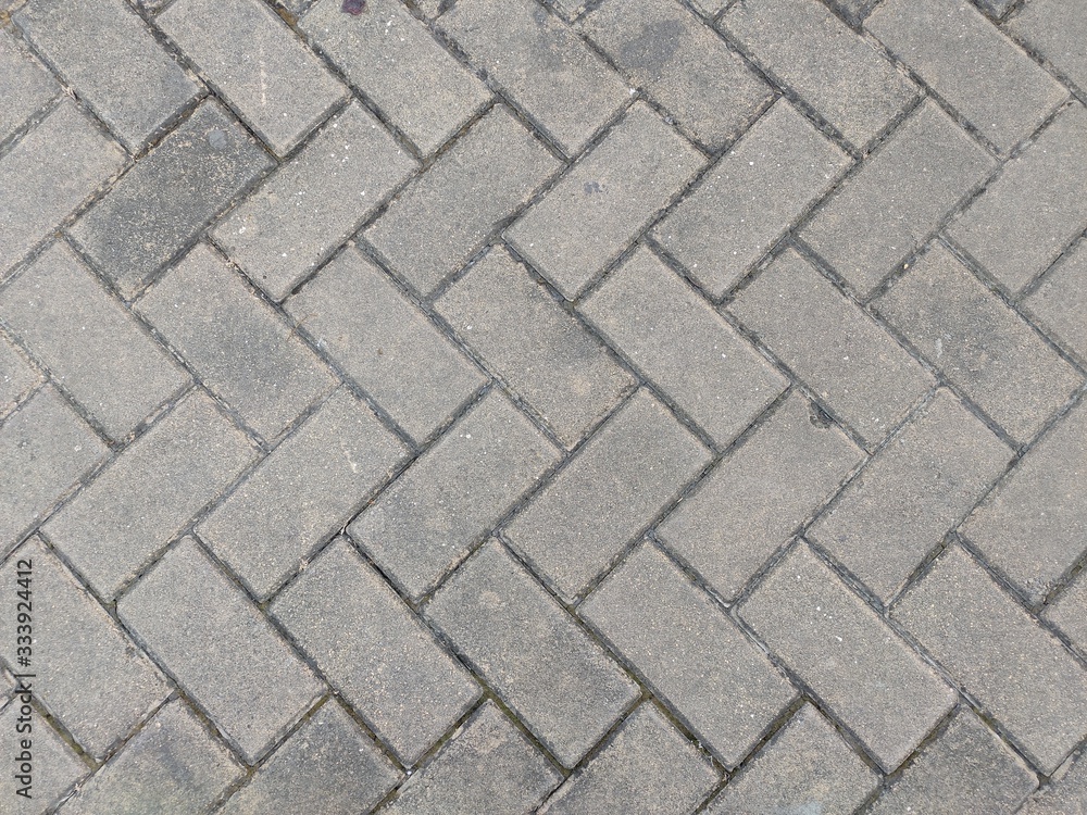 Stone pavement texture. Granite cobblestoned pavement background. Abstract background of old cobblestone pavement close-up. Seamless texture. Perfect tiled on all sides Stone pavement texture. Granite cobblestoned pavement background. Abstract background of old cobblestone pavement close-up. Seamless texture. Perfect tiled on all sides