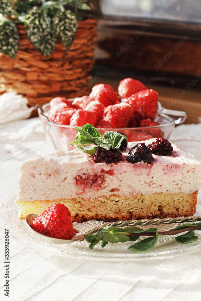 Fresh delicious dessert with berries and green decoration, sweet food, tea time
