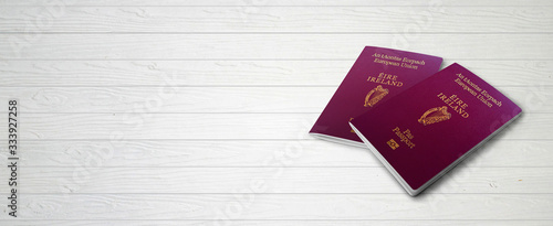 Irish Passports on Wood Lines Background Banner with Copy Space - 3D Illustration