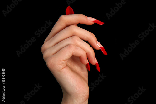 Nails Human fingers with long fingernail and beautiful manicure photo