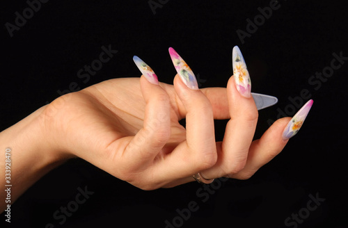 Nails Human fingers with long fingernail and beautiful manicure