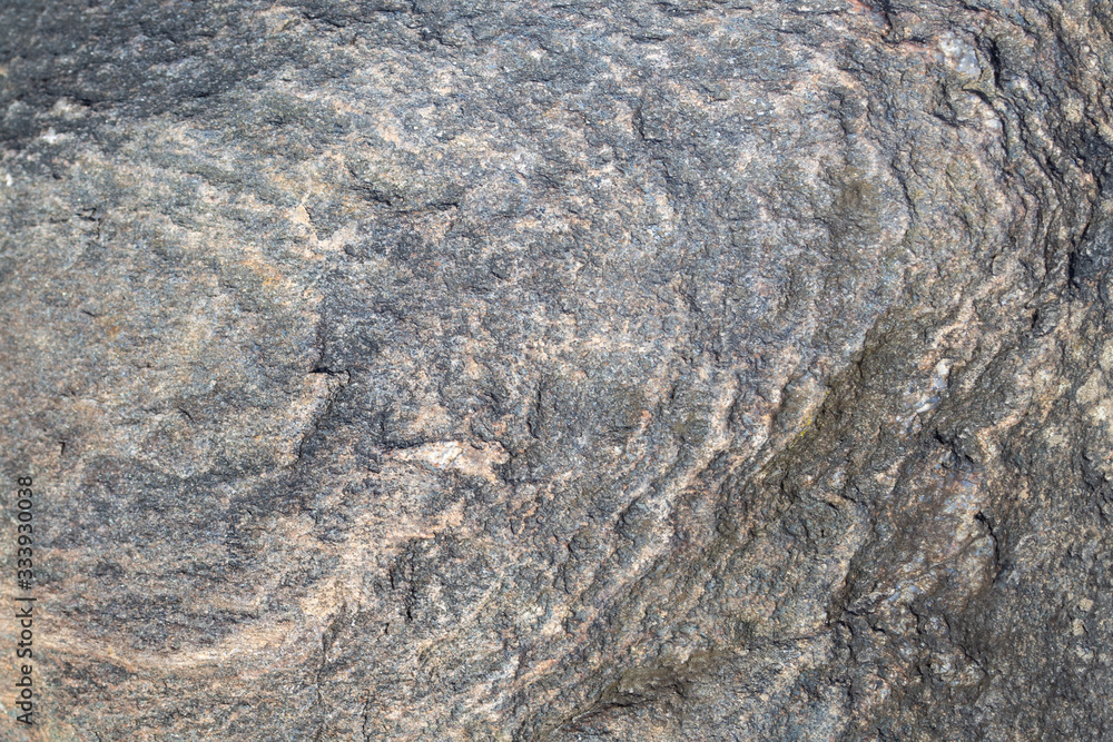 Stone surface with a beautiful circular pattern. Natural granite texture. Stone surface with a beautiful circular pattern. Natural granite texture.