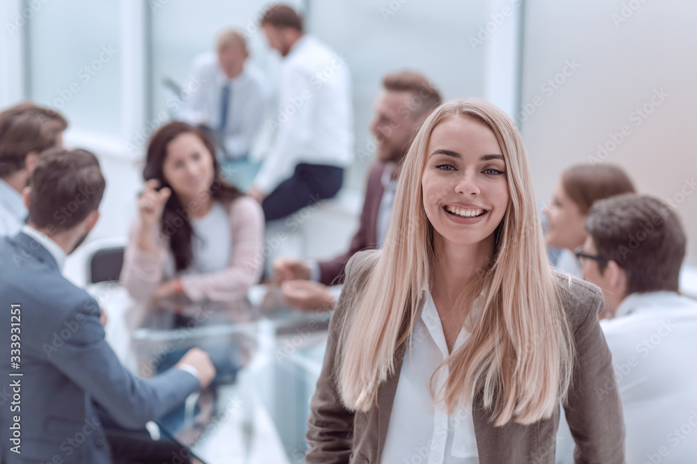close up. smiling young employee standing in the office close up. smiling young employee standing in the office