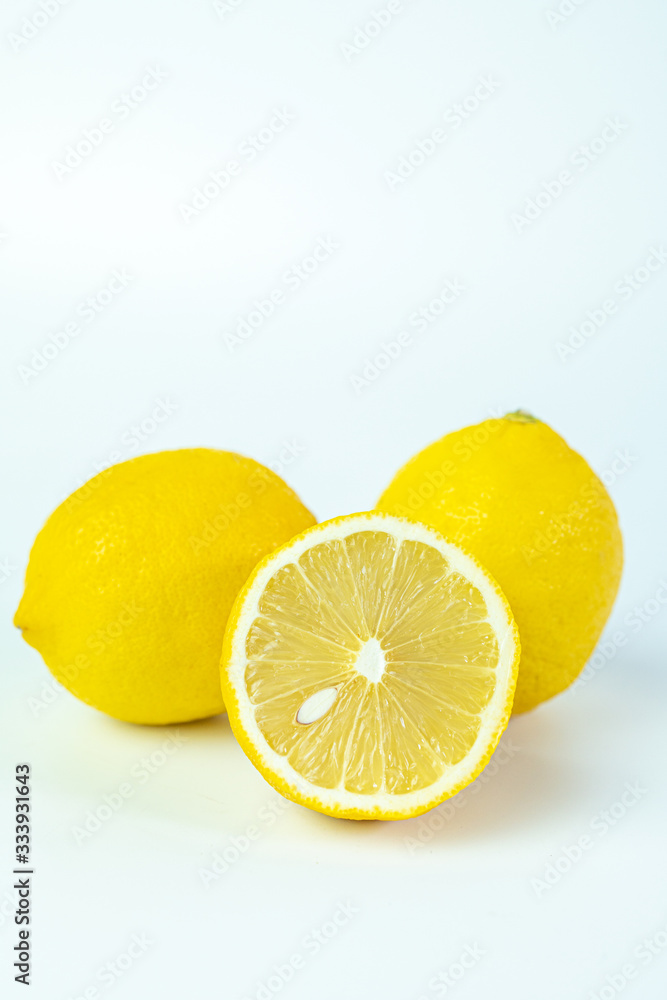 Sliced fresh lemon for summer drink on white background. Sliced fresh lemon for summer drink on white background.
