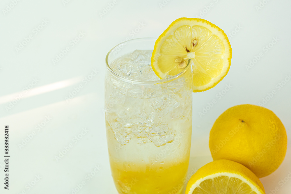 Fresh lemon soda drink iced with lemon sliced on white background. Fresh lemon soda drink iced with lemon sliced on white background.