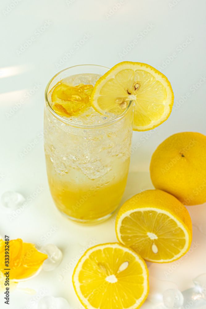 Fresh lemon soda drink iced with lemon sliced on white background. Fresh lemon soda drink iced with lemon sliced on white background.
