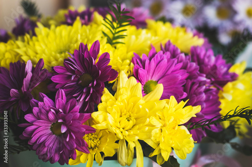 Bouquet of yellow and burgundy flowers. Spring flowers closeup.