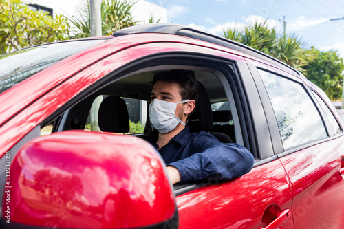Young driver with face mask © Zstock
