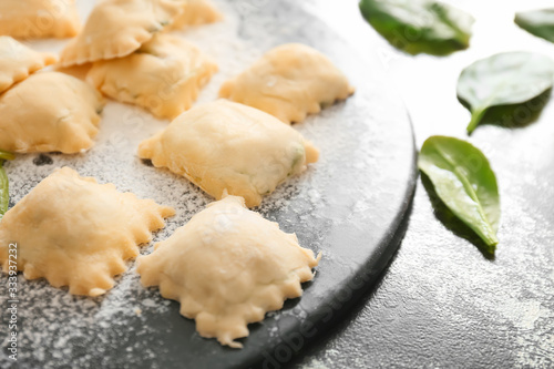 Raw ravioli on board, closeup