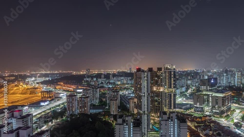 Wallpaper Mural City skyline with commercial port of Singapore night timelapse. Panoramic view of busiest Asian cargo port with hundreds of ships loading export and import goods and thousands of containers in harbor Torontodigital.ca