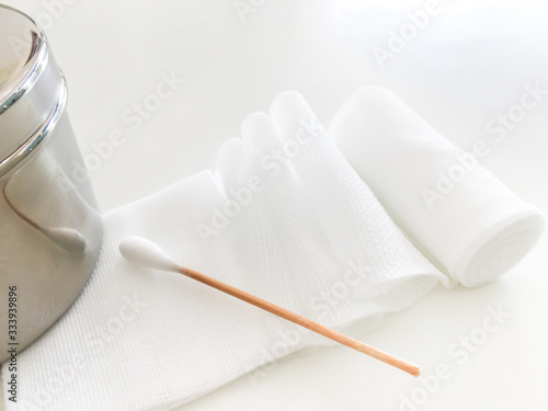 swab and roll gauze bandage and jar in medical conceot