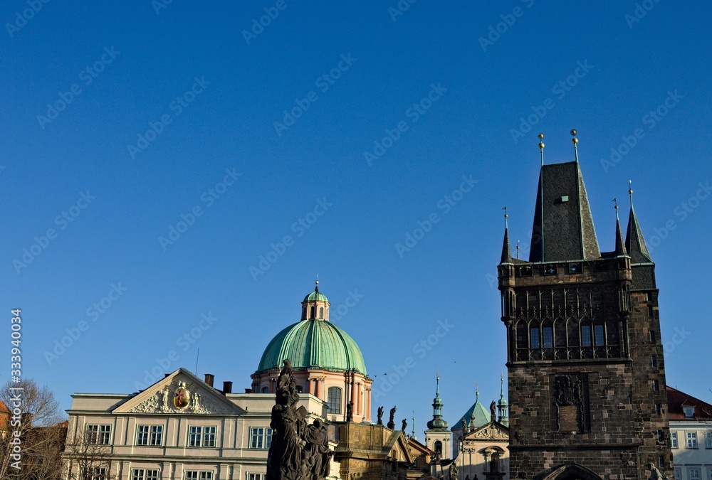Fototapeta premium View of the Charles Bridge Tower and the statues on the Charles Bridge (Prague, Czech Republic, Europe)