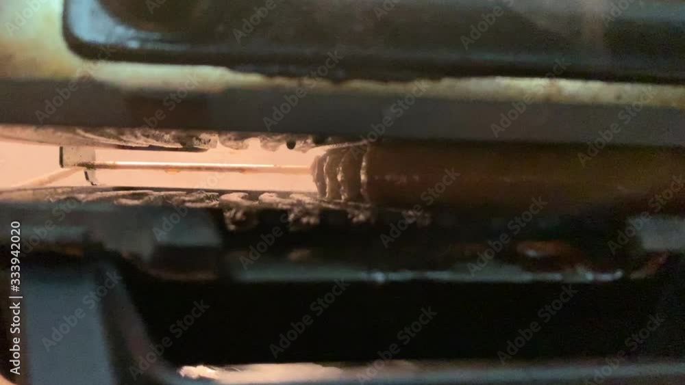 Sausages are fried on the old grill from the inside. Sausages are fried on the old grill from the inside.