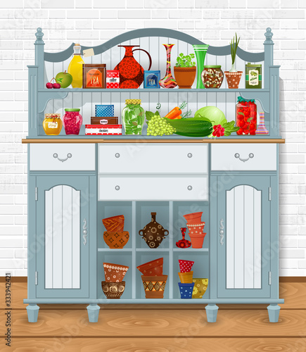 ornate vintage cupboard with food, vegetables and ceramic pots o