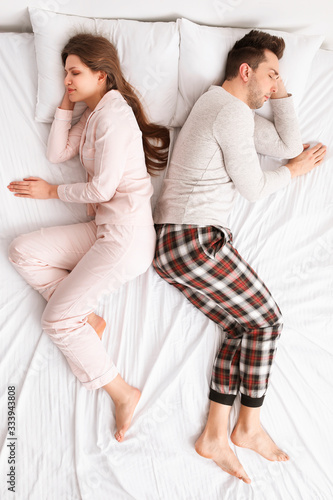 Young couple sleeping in bed