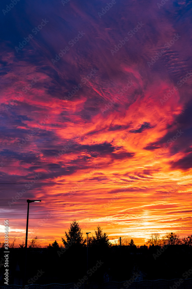 Colorful sky at sunset. Dramatic fiery sunset sky