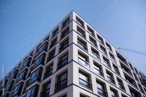 Urban lifestyle. Facade of new modern residential house. Apartment building in the city. 
