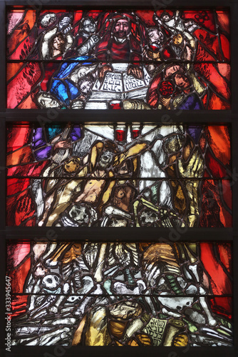 God bears the guilt of all mankind, stained glass window by Sieger Koder in church of Saint John in Piflas, Germany
