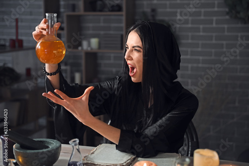 Female alchemist with elixi...